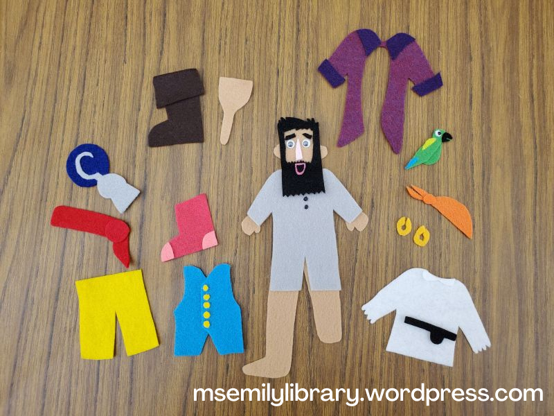 Photo of all the separate pieces of the Pirate Jack felt set, including gray long johns, a white shirt, yellow pants, a blue vest, a pink sock, a brown boot and brown peg leg, a red waist sash, an orange head sash, a silver (gray) hook, a purple coat, gold earrings, and a green parrot.