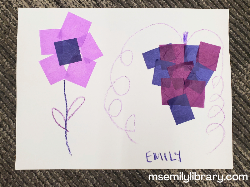 craft showing a flower and bunch of grapes made with tissue squares and crayons.